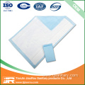 Puppy pee pad with adhesive sticker